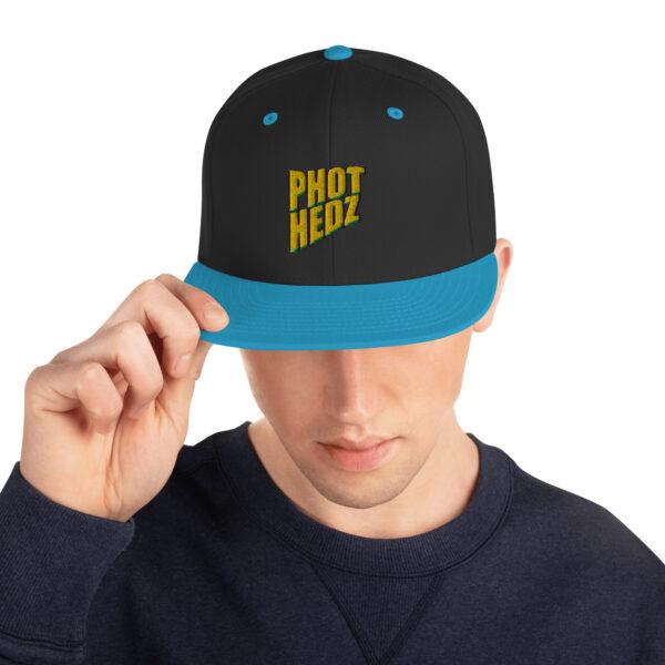 classic-snapback-black-teal-front-64133d86c3464.jpg