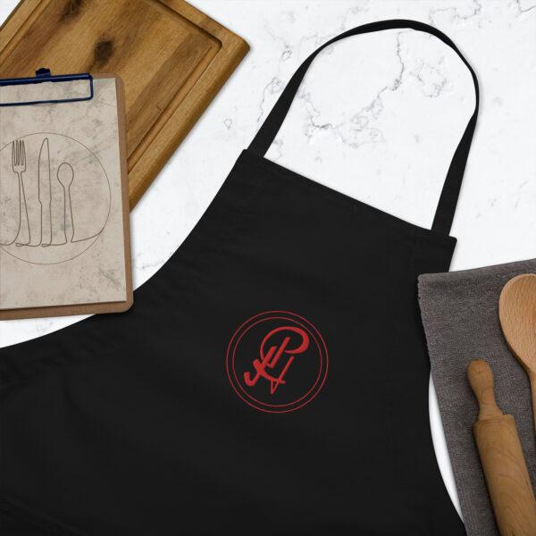 embroidered-apron-black-zoomed-in-6409630e2583a.jpg