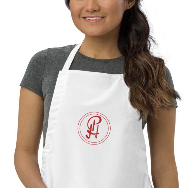 embroidered-apron-white-zoomed-in-6409630e25528.jpg