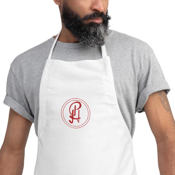 embroidered-apron-white-zoomed-in-6409630e25601.jpg