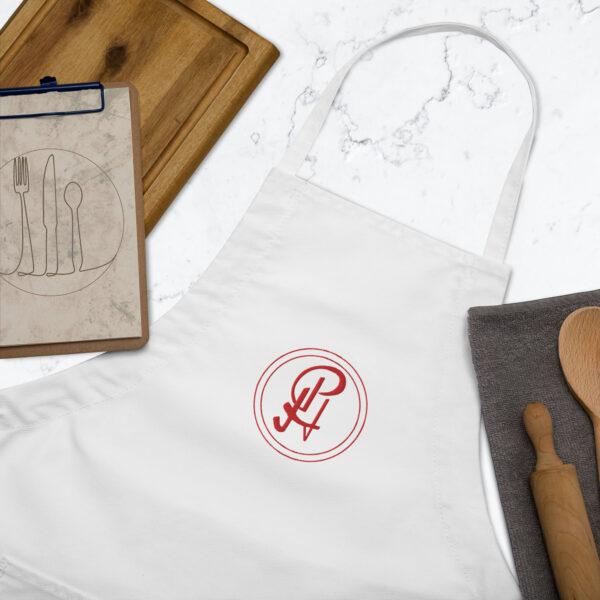 embroidered-apron-white-zoomed-in-6409630e259b0.jpg